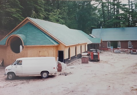 Under Construction -a building addition to a small red brick church